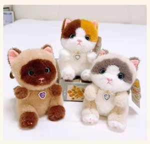 Cute scented bean bag cat plush toy keychain pendant with sparkling heart pendant and soft faux fur fabric detail.