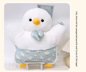 White plush duck pillow detail, cute animal cushion close up, soft toy interior decor view.