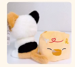 Detailed view of the cute calico cat plush toy, featuring soft fur and a matching zodiac bag.