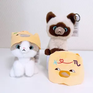 Cute plush cat toy keychain with removable headgear, soft cartoon kitten doll pendant for bags.
