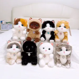 Cute plush cat doll keychain set with pearl necklace and heart pendant, soft toy collection.