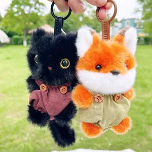Cute plush fox and black cat keychains with overalls, soft stuffed animal bag charms.