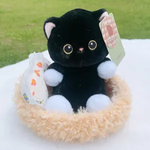 Cute black cat plush toy in fuzzy basket with white paws, soft stuffed animal doll for gifts.