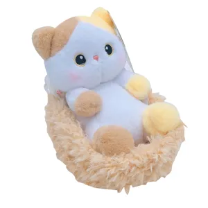 Cute calico cat plush toy in a soft cradle basket, perfect doll gift for girls and kids.
