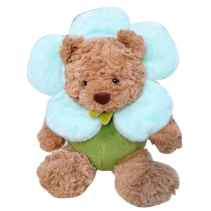Cute flower teddy bear plush toy, soft stuffed animal doll with blue flower collar, perfect gift.
