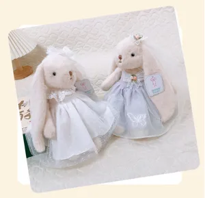 Plush lop-eared rabbit doll detail shot, showing exquisite lace wedding dress, veil and cute design.