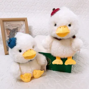 Cute white plush duck couple dolls with colorful hats and gift box, perfect healing companion gift.
