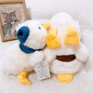 Cute white plush duck stuffed toy with blue earmuffs and brown belt, healing gift.