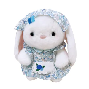 Cute pastoral style plush rabbit toy with blue floral dress and long ears main image.