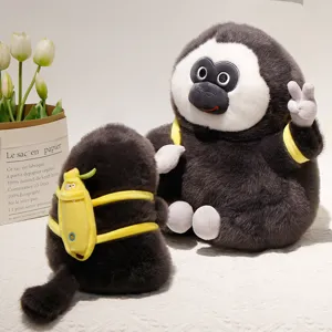 Simpatica scimmia di peluche dal viso bianco con zaino a banana bambola morbida regalo