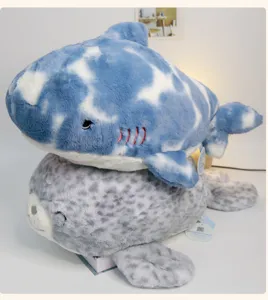 Cute marine plush toy set featuring a soft blue shark and a spotted seal for cozy sleeping.