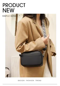 Black genuine leather crossbody bag for women, stylish camera bag with wide strap.