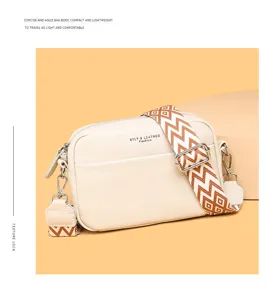 Genuine leather crossbody bag detail featuring wide geometric strap and compact design for daily.