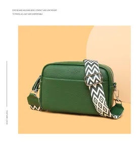 Green genuine leather crossbody bag with geometric wide strap, stylish compact camera bag.