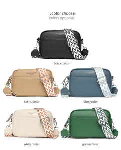 Detail view of genuine leather women crossbody bag with multi-color options and wide straps.