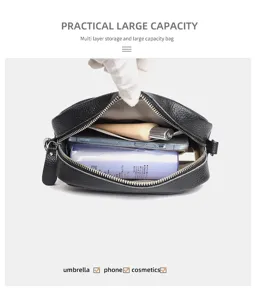 Detail view of black leather crossbody bag showing multi-layer large capacity storage.