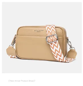 Genuine leather crossbody bag for women, stylish wide strap camera shoulder handbag.