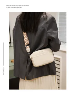 Genuine leather crossbody bag for women, minimalist daily shoulder bag with wide strap detail.
