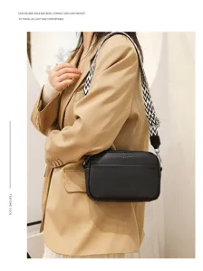 Black leather crossbody bag for women, stylish compact shoulder bag with wide woven strap.