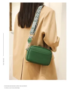 Stylish genuine leather crossbody bag for women with wide strap, compact and chic shoulder bag.