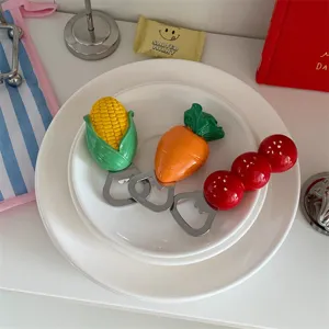 Detailed view of cute cartoon fruit shaped magnetic bottle opener for kitchen fridge decor.