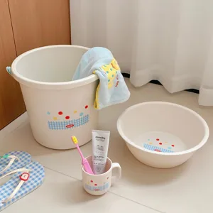 Detailed view of the student dorm wash set including bucket, basin, toothbrush, cup and towel.