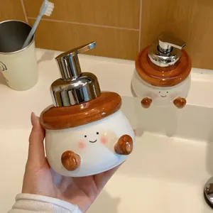 Close-up detail of cute ceramic foam soap dispenser bottle with cute face and pump design.