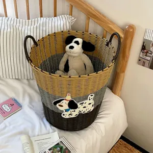 Large capacity woven laundry basket with cute dog patch and plush toy interior for bedroom.