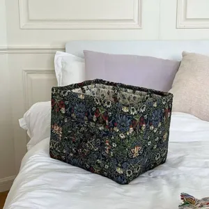 Detail view of fabric storage basket with floral botanical print and interior dividers for home.