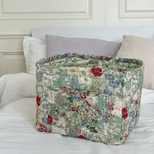 Floral quilted fabric storage basket detail, portable organizer bin for underwear.