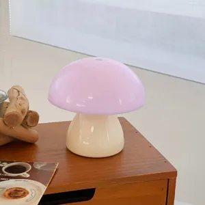 Creative pink mushroom night light, cute bedside table lamp and cozy room decor aesthetic.