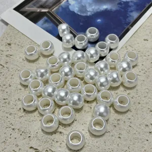 Detailed view of 10mm white acrylic imitation pearl large hole beads for DIY jewelry crafts.