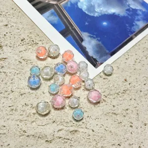 Detailed view of 8-10mm transparent acrylic beads with colorful inner core for DIY handmade phone charms.