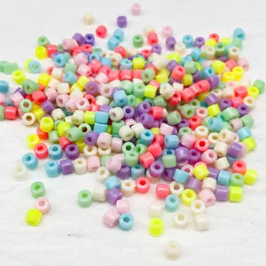 Detailed view of colorful acrylic barrel beads, 3x5mm loose beads for DIY children crafts and jewelry.