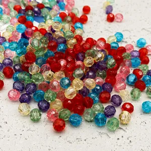 Close-up detail of colorful faceted acrylic beads, ideal for DIY jewelry and phone chain parts.