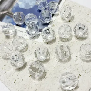 Close-up detail shot of clear acrylic faceted loose beads for DIY jewelry making and bracelets.