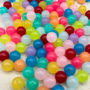 Colorful round plastic beads detail shot, DIY craft jewelry making accessories bulk.
