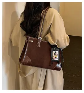 Retro brown women's shoulder tote bag detail view, vintage PU leather daily commute style.