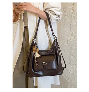 Retro braune multifunktionale Handtasche Detailansicht mit hochwertigem Leder und praktischem Design.