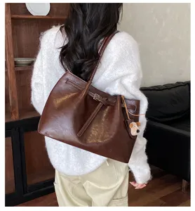 Vintage brown tote bag for women, large capacity shoulder bag with cute puppy charm detail.