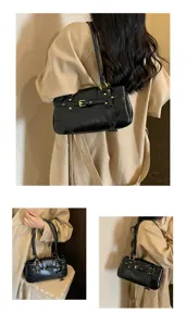 Korean style retro underarm baguette bag for women, trendy black shoulder bag with metal details.