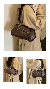 Detailed view of the vintage brown underarm shoulder bag showcasing chic buckle and rivet accents.