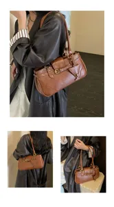 Retro brown leather shoulder bag for women, chic vintage baguette bag with stylish metal buckles.
