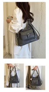 Detailansicht der dunkelgrauen Retro-Slouchy-Schultertasche mit Frontschnalle und Schal.