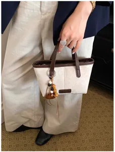 Retro suede bucket bag women's small handbag with top handle and charm pendants