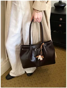 Retro brown leather tote bag for women, large capacity casual shoulder bag with cute charm.