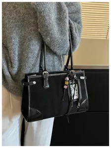Stylish black tote bag for women, retro commuter shoulder bag with patent leather and suede.