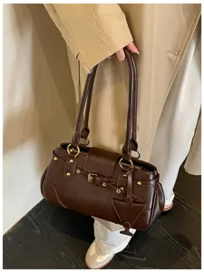Dark brown vintage underarm baguette bag detail, premium PU leather with stylish metal hardware.