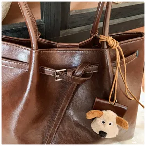 Dark brown vintage tote bag for women, large capacity shoulder bag with cute plush dog pendant.