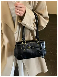 Vintage black shoulder bag for women, stylish underarm baguette bag with chic buckles.